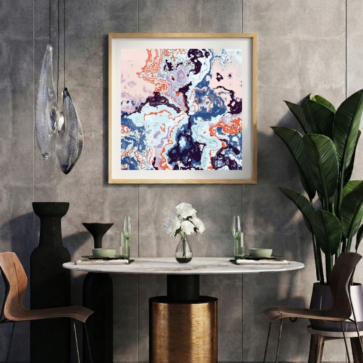 Modern interior with a colorful abstract print on a gray wall, marble table, and decorative items.