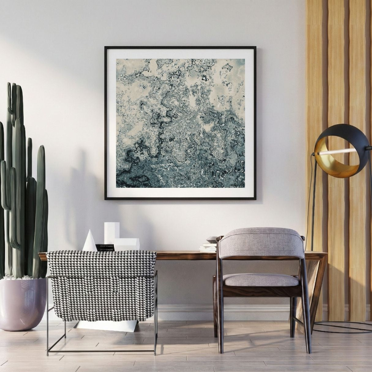 Modern interior with a abstract art print on the wall, chair, and potted plant.