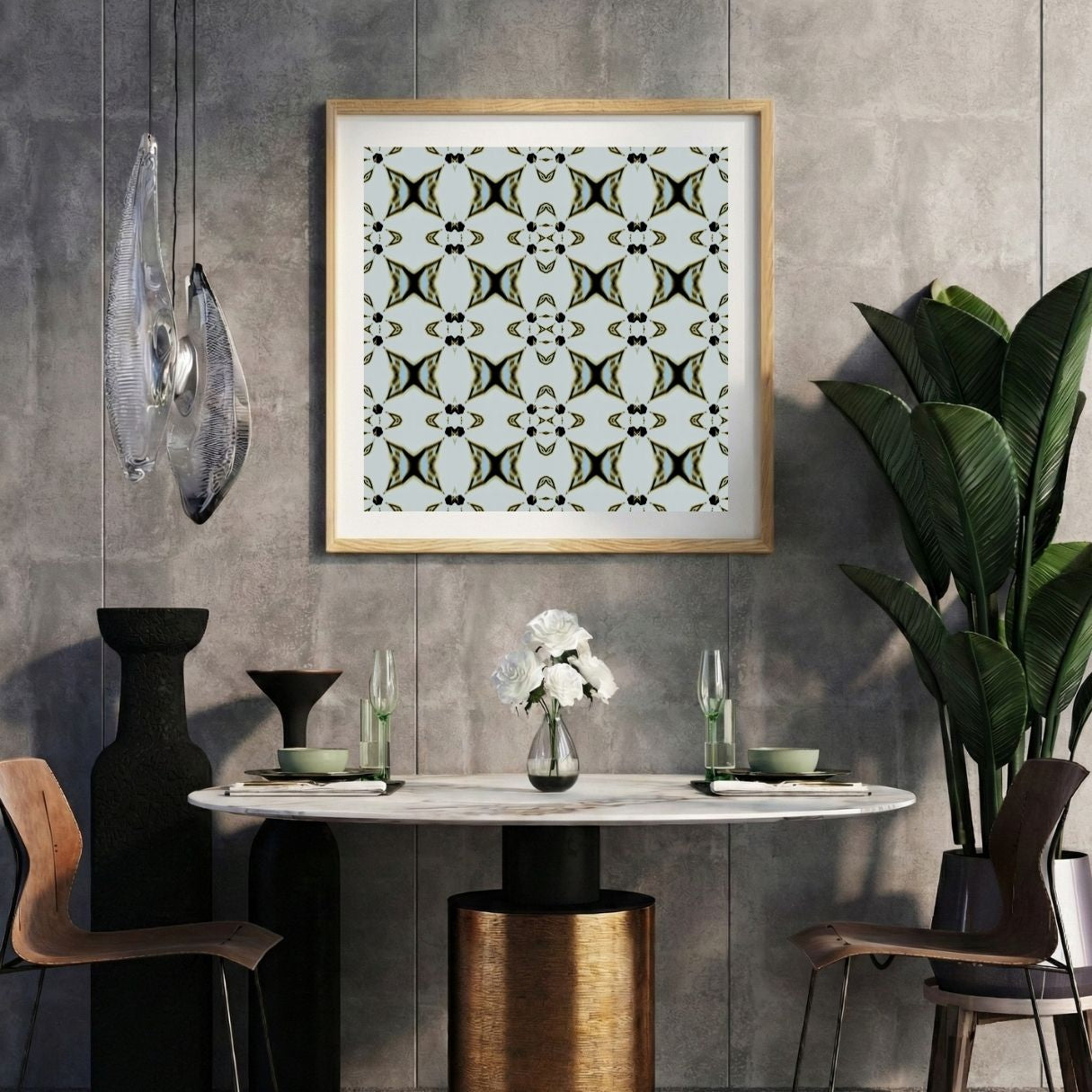 Modern interior with a ornamental pattern print on a gray wall, marble table, and decorative items.