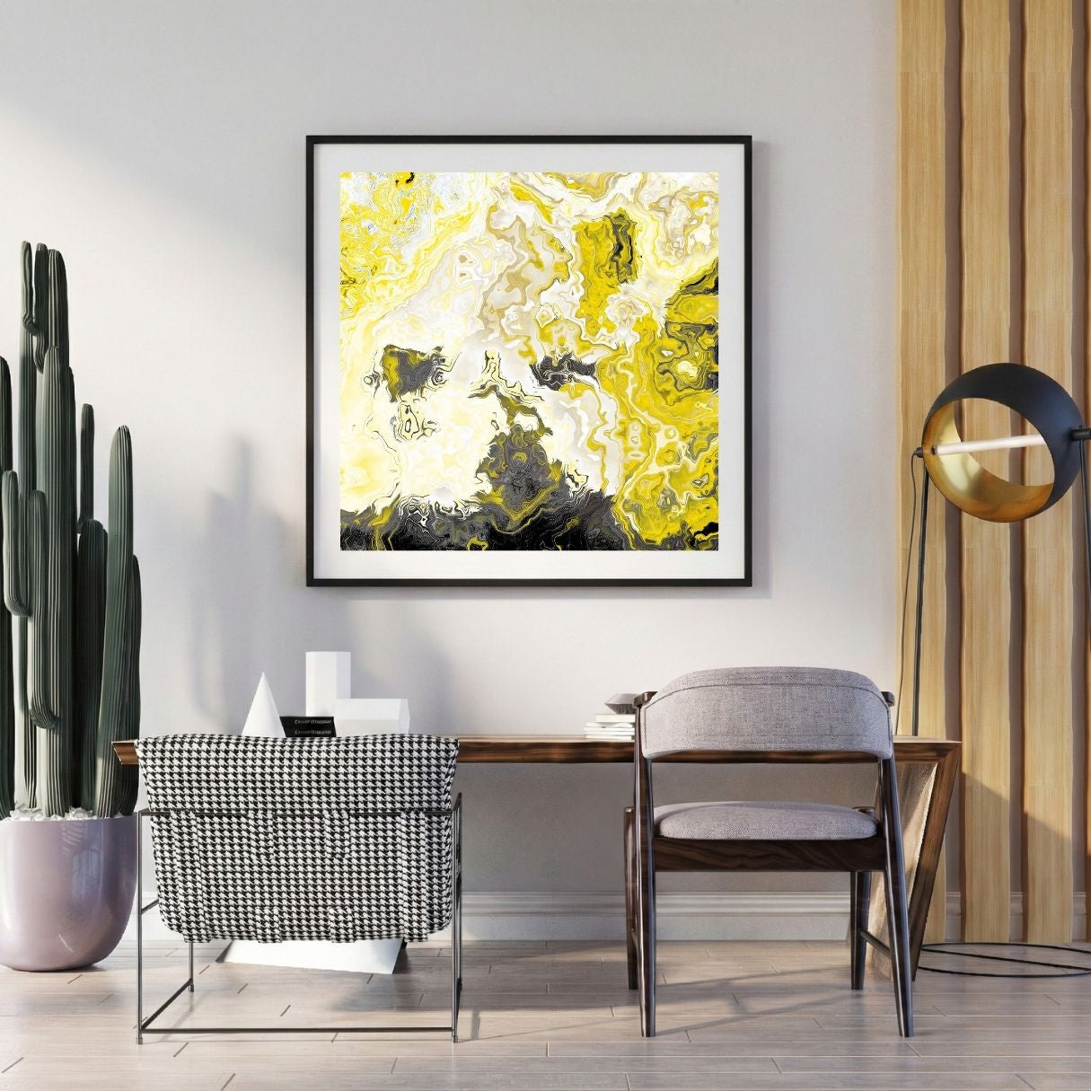 Modern interior with abstract yellow and black artwork on the wall, a desk, and decorative items.