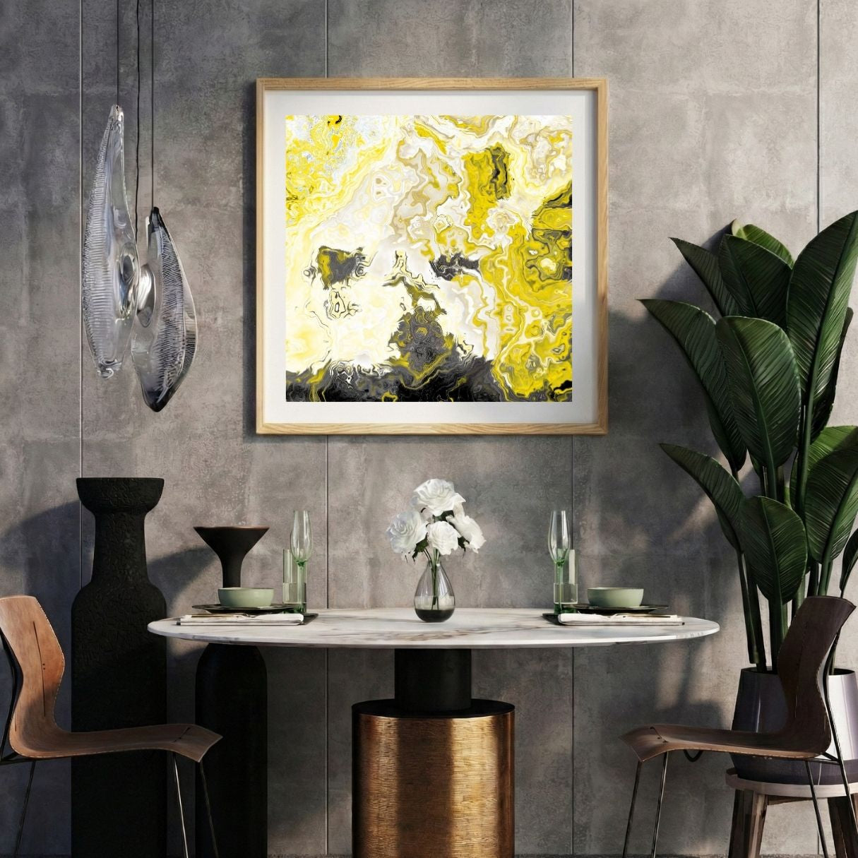 Modern interior with a yellow abstract print on a gray wall, marble table, and decorative items.