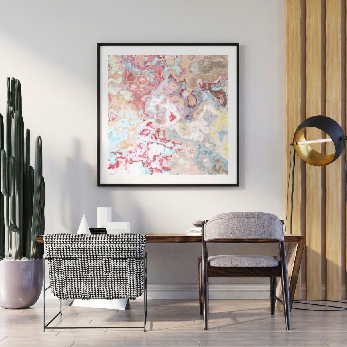 Modern interior with a abstract art print on the wall, chair, and potted plant.