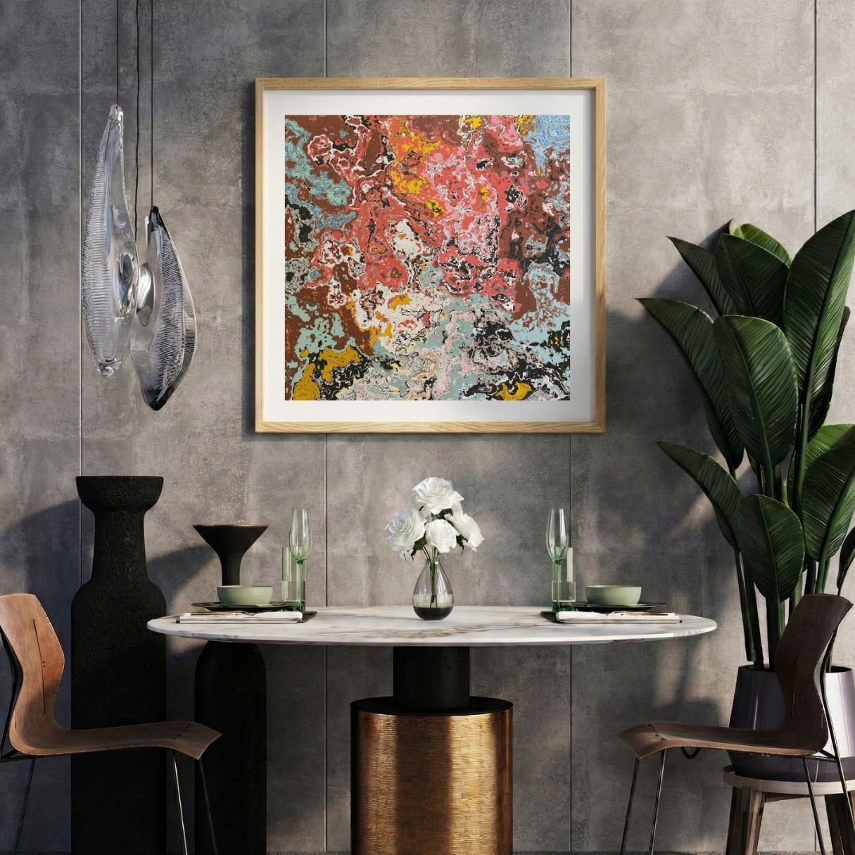 Modern interior with a colorful abstract print on a gray wall, marble table, and decorative items.