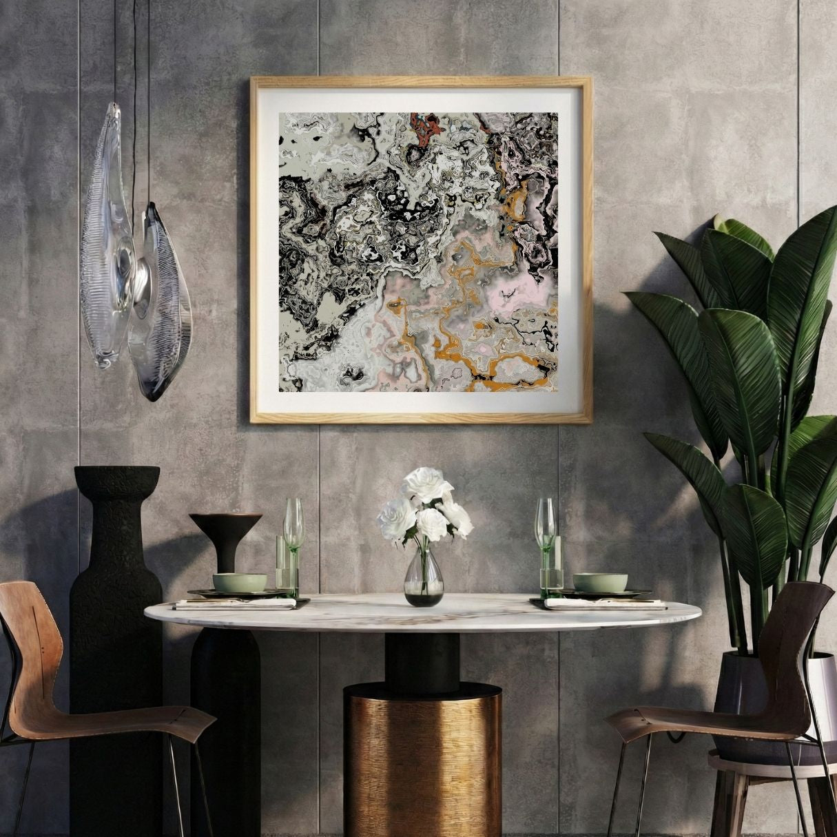 Modern interior with a grey abstract print on a gray wall, marble table, and decorative items.
