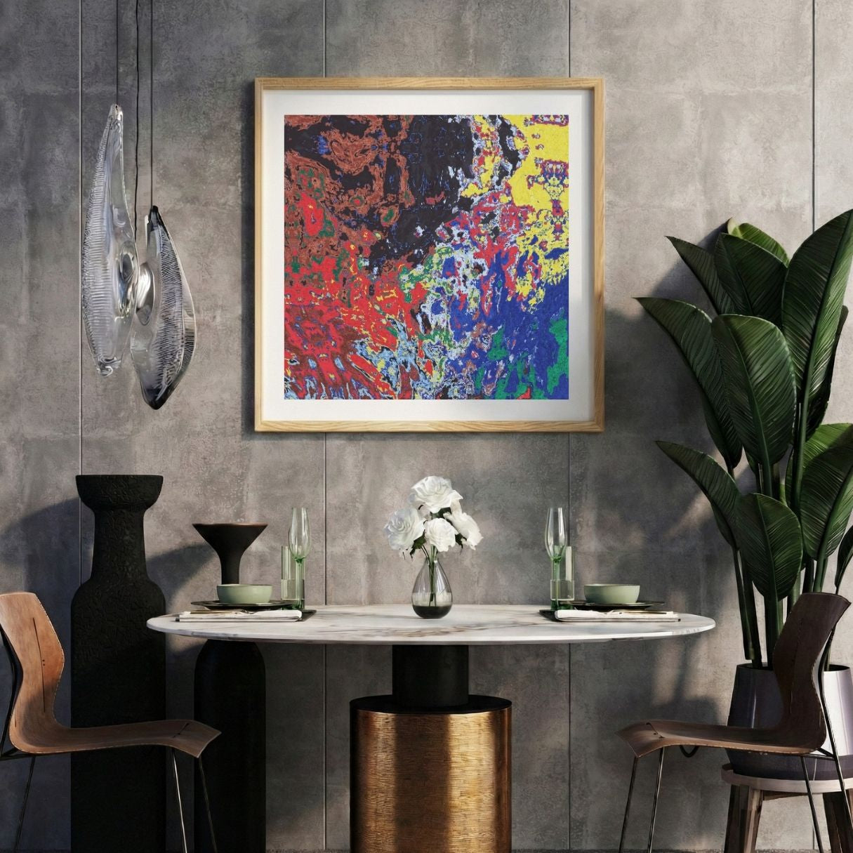 Modern interior with a colorful abstract print on a gray wall, marble table, and decorative items.