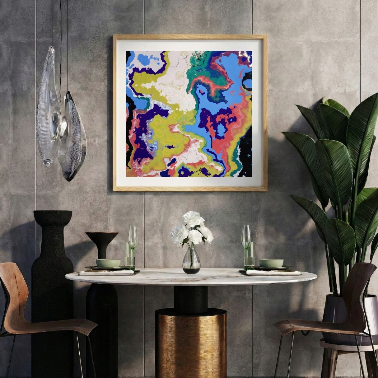 Modern interior with a colorful abstract print on a gray wall, marble table, and decorative items.