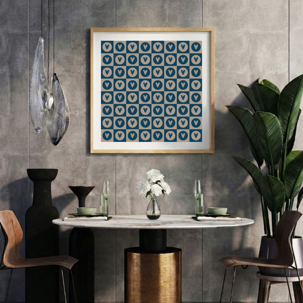 Modern interior with a ornamental heart print on a gray wall, marble table, and decorative items.