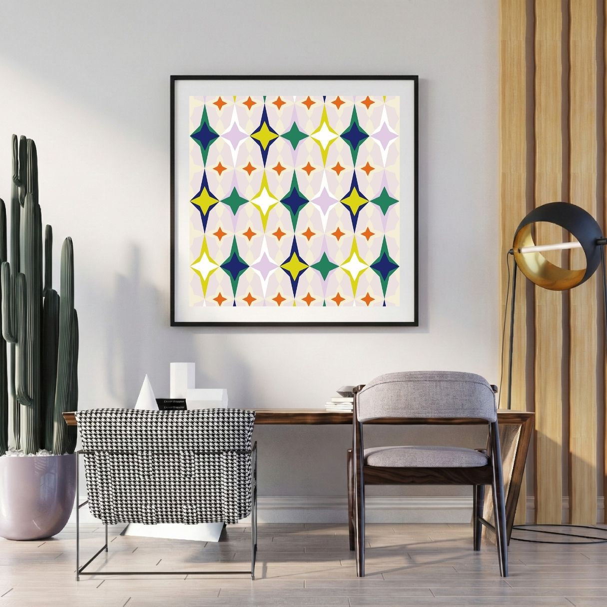 Modern interior with a colorful geometric art print on the wall, a desk, and decorative items.