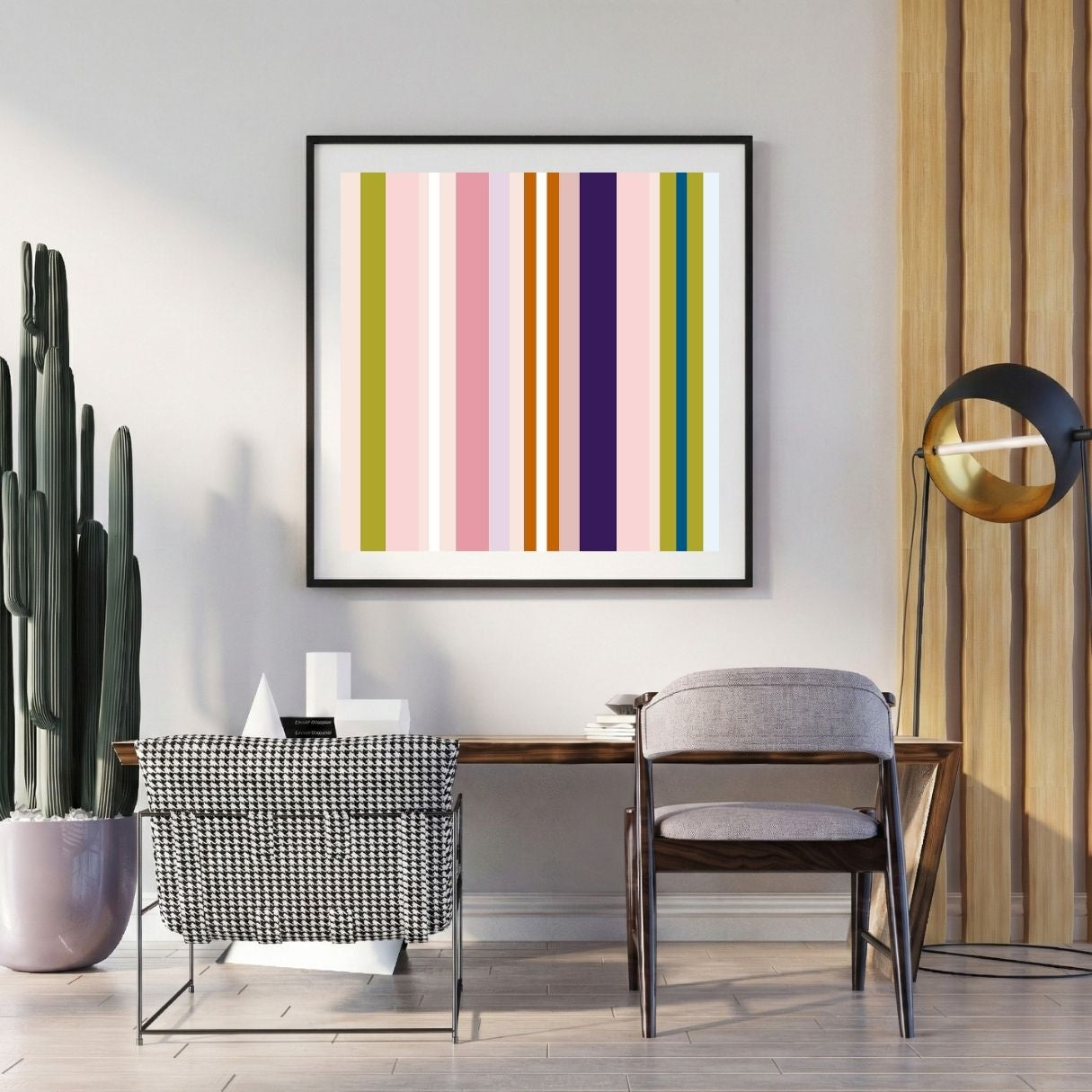 Modern interior with a colorful striped artwork on the wall, a desk, and decorative items.