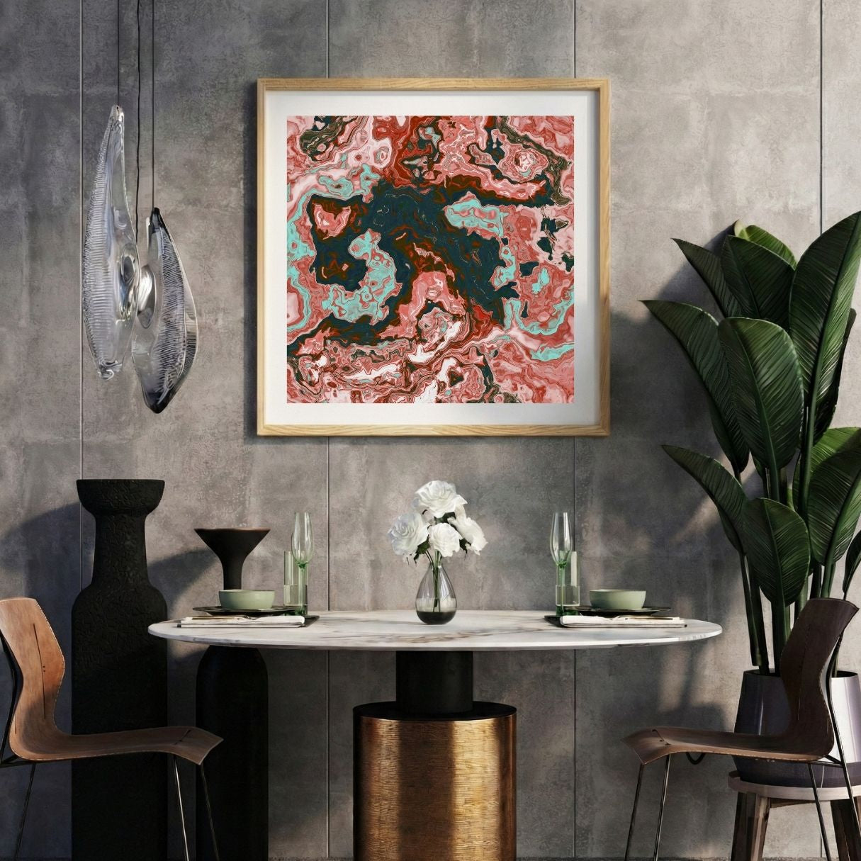 Modern interior with a marbled red abstract print on a gray wall, marble table, and decorative items.
