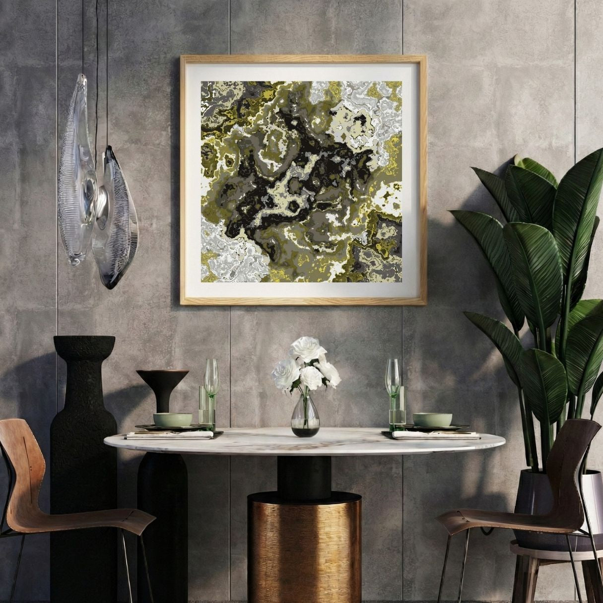 Modern interior with a grey and yellow abstract print on a gray wall, marble table, and decorative items.