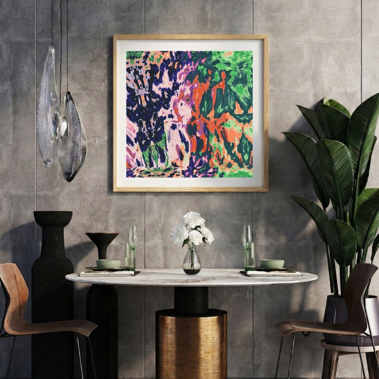 Modern interior with a colorful abstract print on a gray wall, marble table, and decorative items.
