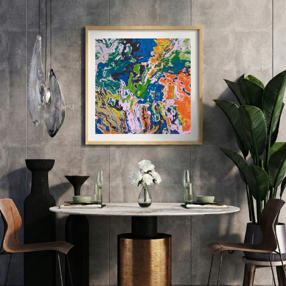Modern interior with a colorful abstract print on a gray wall, marble table, and decorative items.