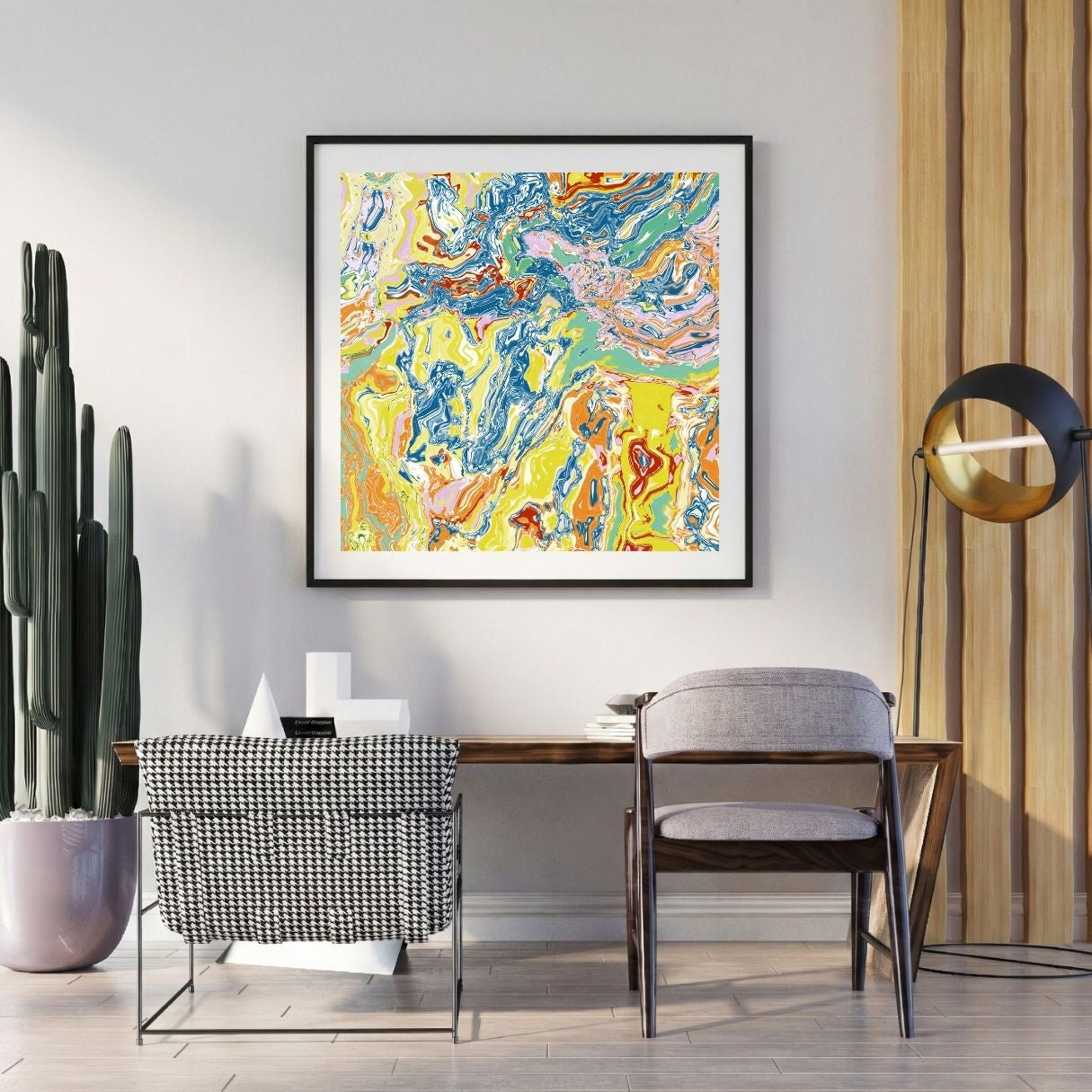 Modern interior with a colorful abstract print on the wall, a desk, and decorative items.