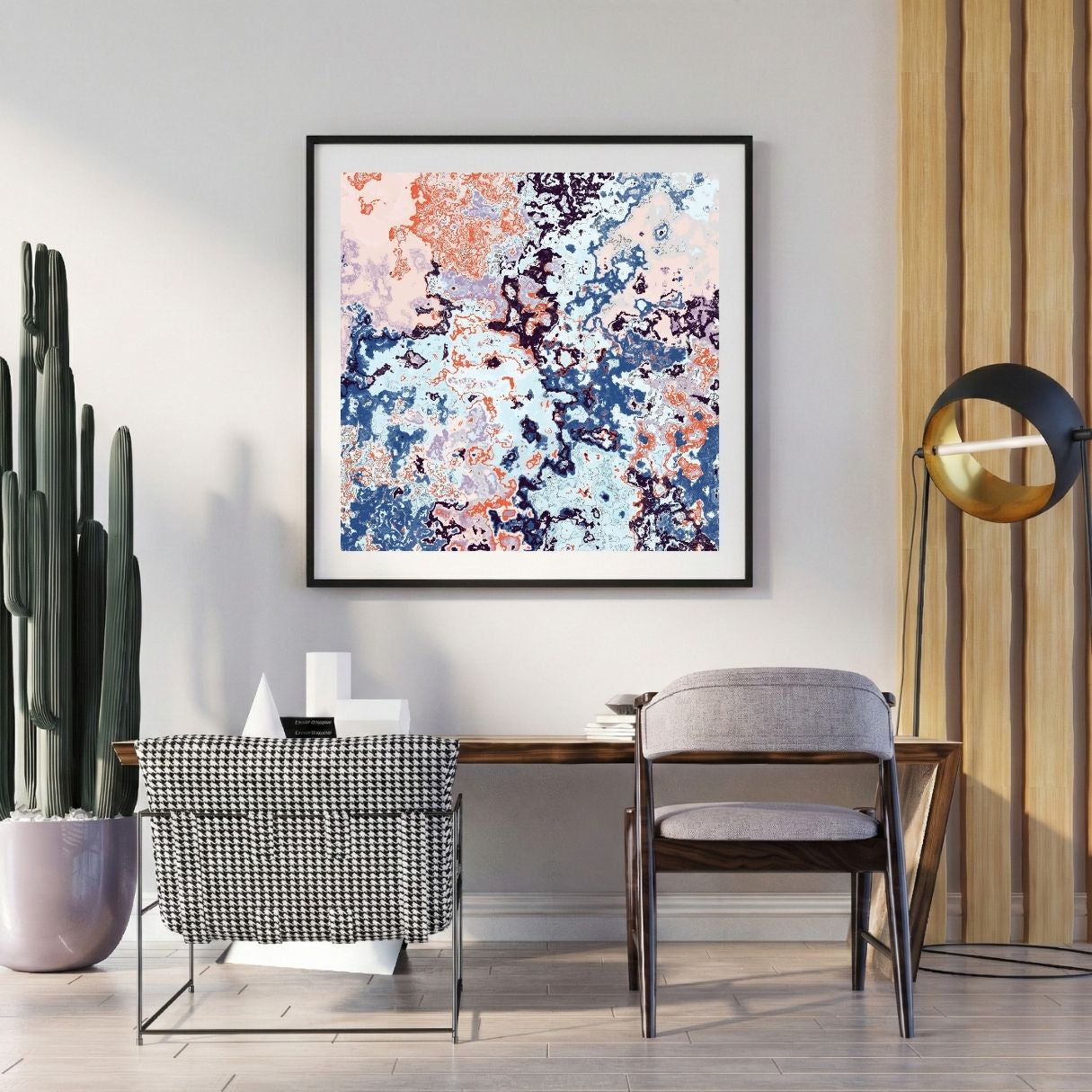 Modern interior with a abstract art print on the wall, chair, and potted plant.