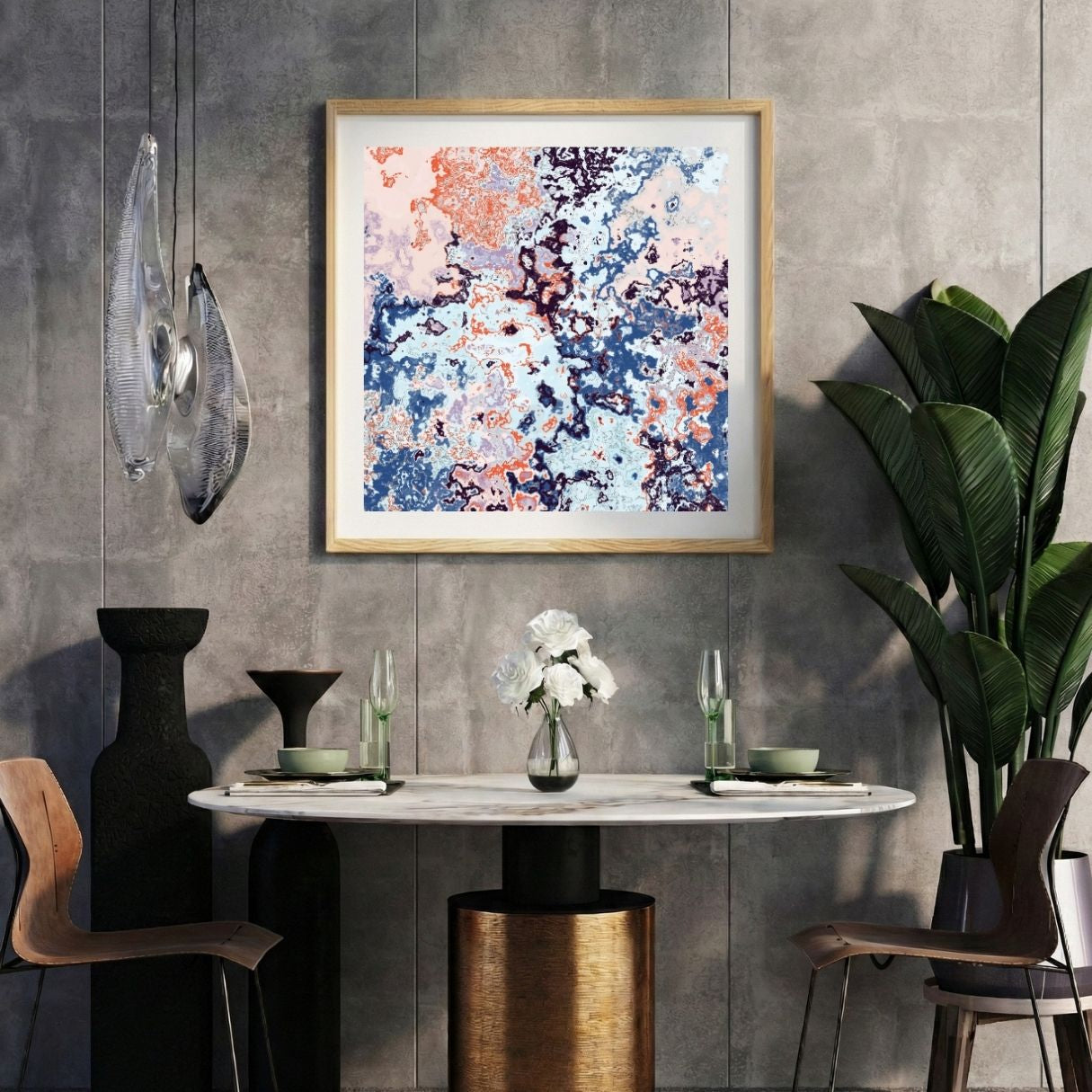 Modern interior with a colorful abstract print on a gray wall, marble table, and decorative items.