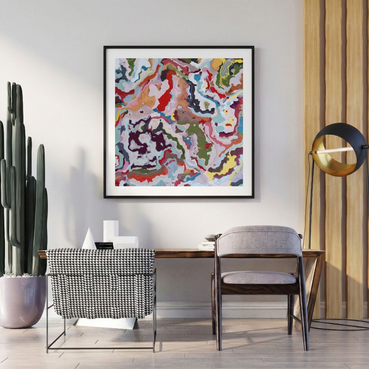 Modern interior with a colorful abstract painting on the wall, a desk, and decorative items.
