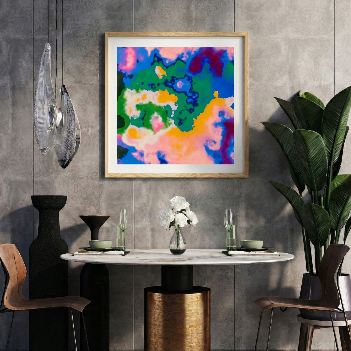 Modern interior with a colorful abstract print on a gray wall, marble table, and decorative items.