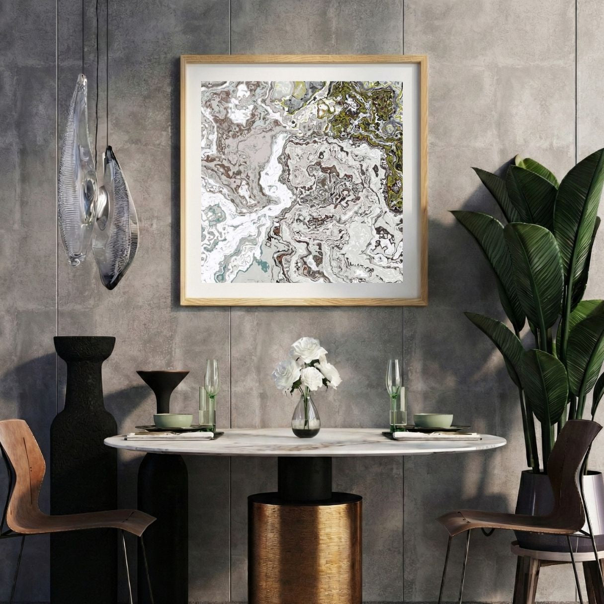Modern interior with a marbled abstract print on a gray wall, marble table, and decorative items.