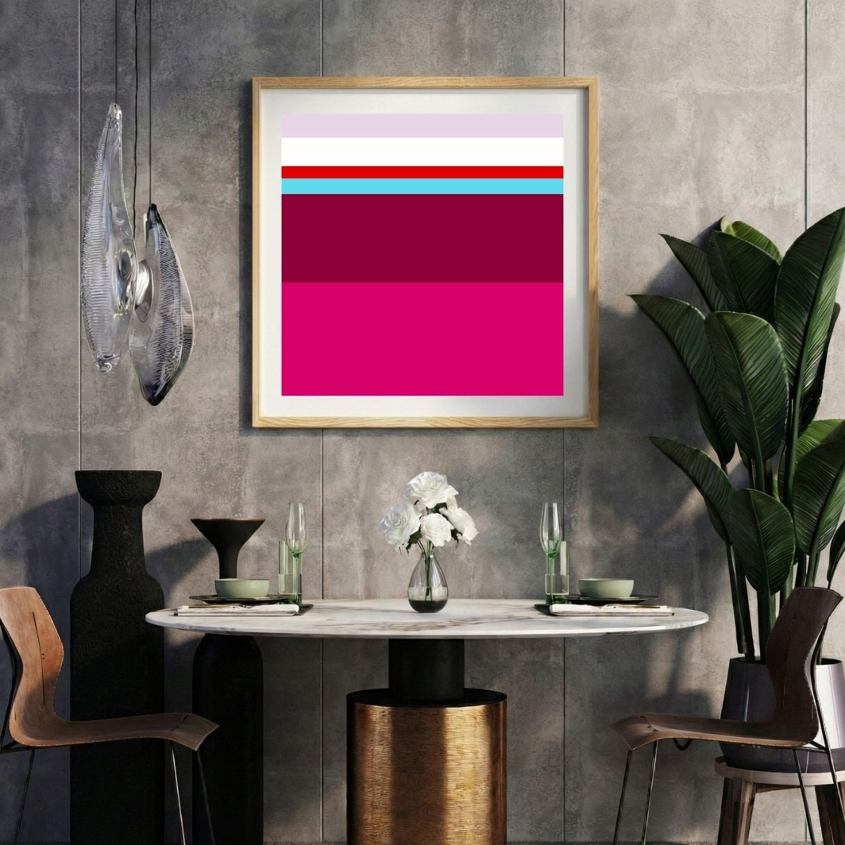 Modern interior with a fuchsia pink striped print on a gray wall, marble table, and decorative items.