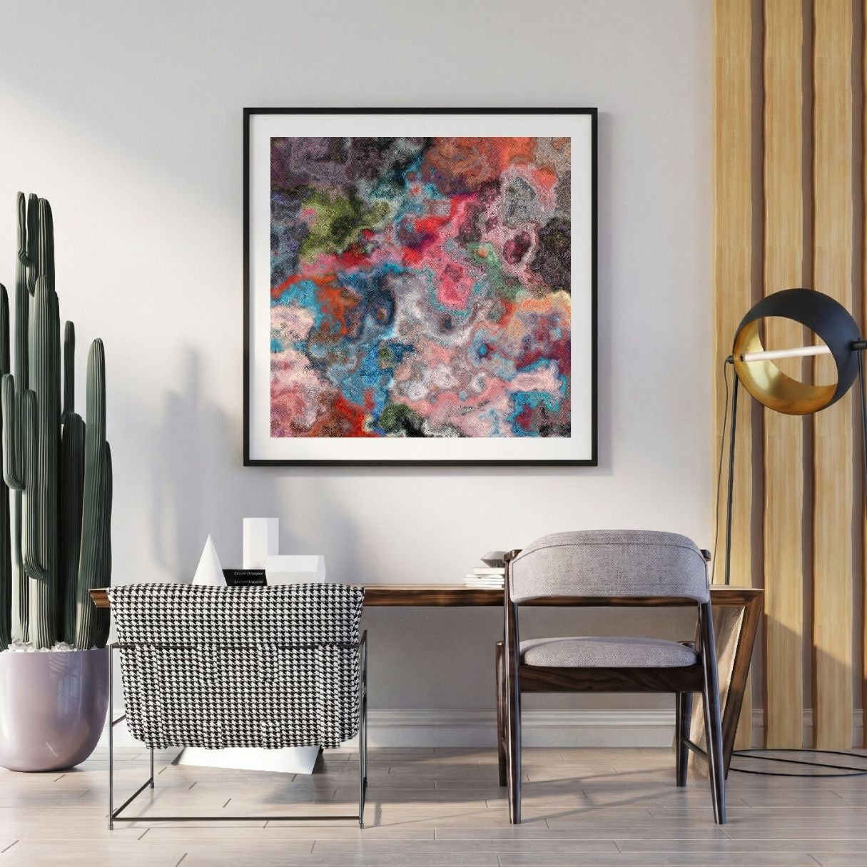 Modern interior with a abstract art print on the wall, chair, and potted plant.