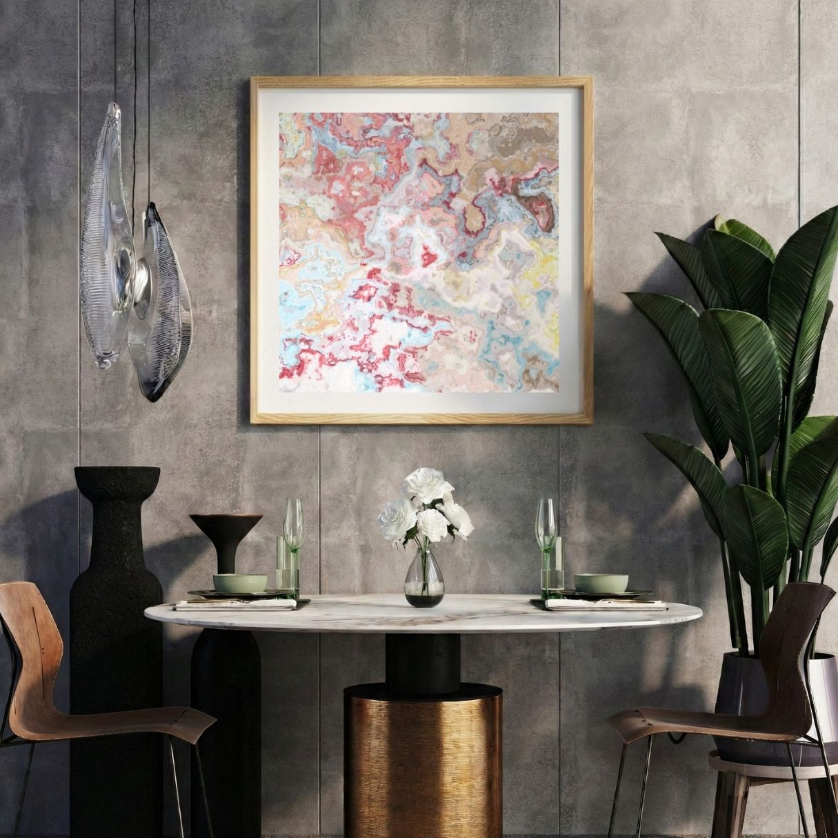 Modern interior with a colorful abstract print on a gray wall, marble table, and decorative items.