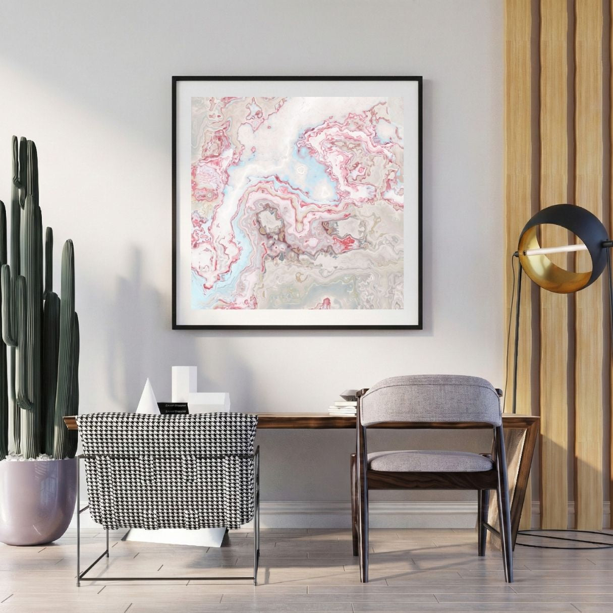 Modern interior with a abstract art print on the wall, chair, and potted plant.