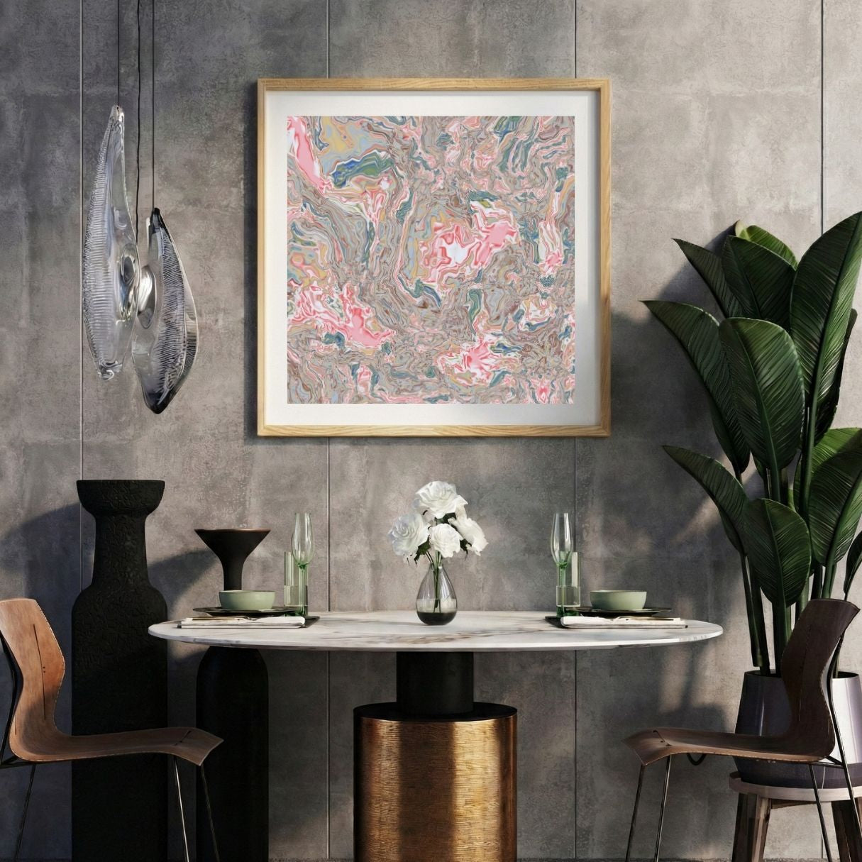 Modern interior with a marbled multicolor abstract print on a gray wall, marble table, and decorative items.