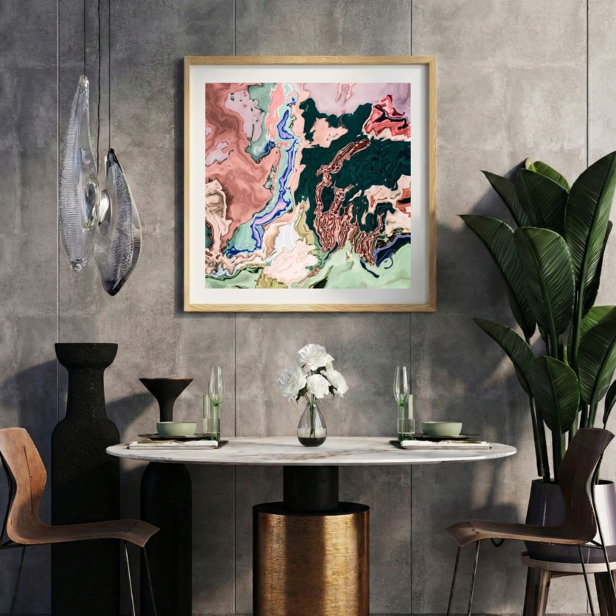 Modern interior with a colorful abstract print on a gray wall, marble table, and decorative items.