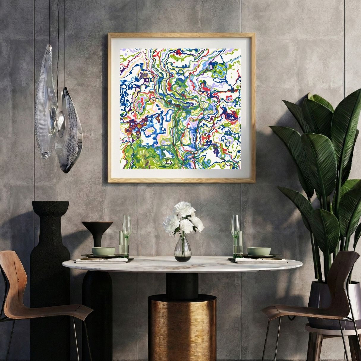 Modern interior with a colorful abstract print on a gray wall, marble table, and decorative items.