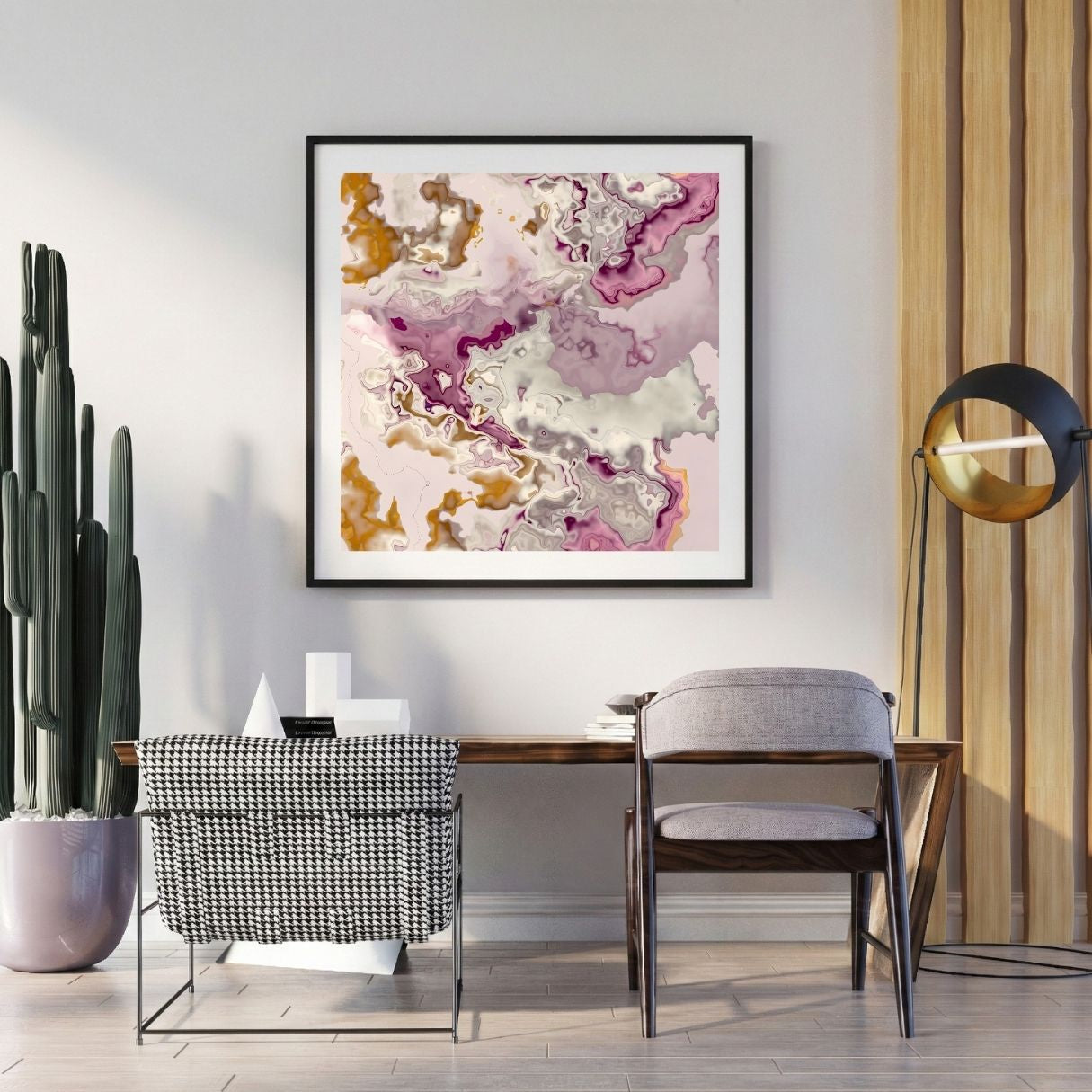 Modern interior with abstract art, chairs, and decor items on a light gray wall.