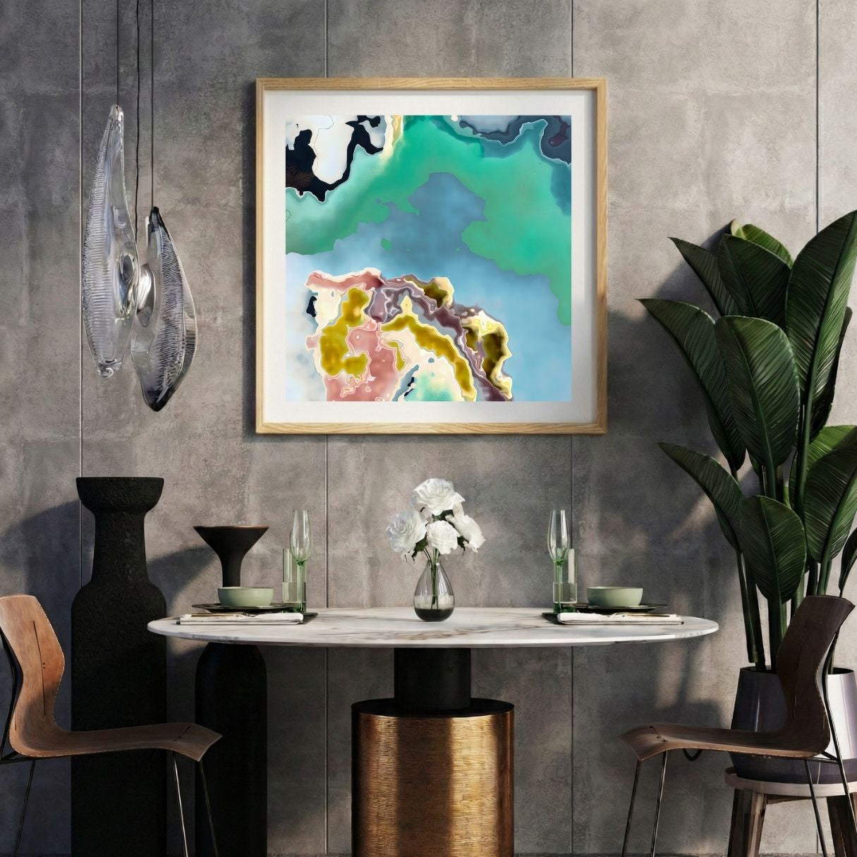 Modern interior with a colorful abstract print on a gray wall, marble table, and decorative items.