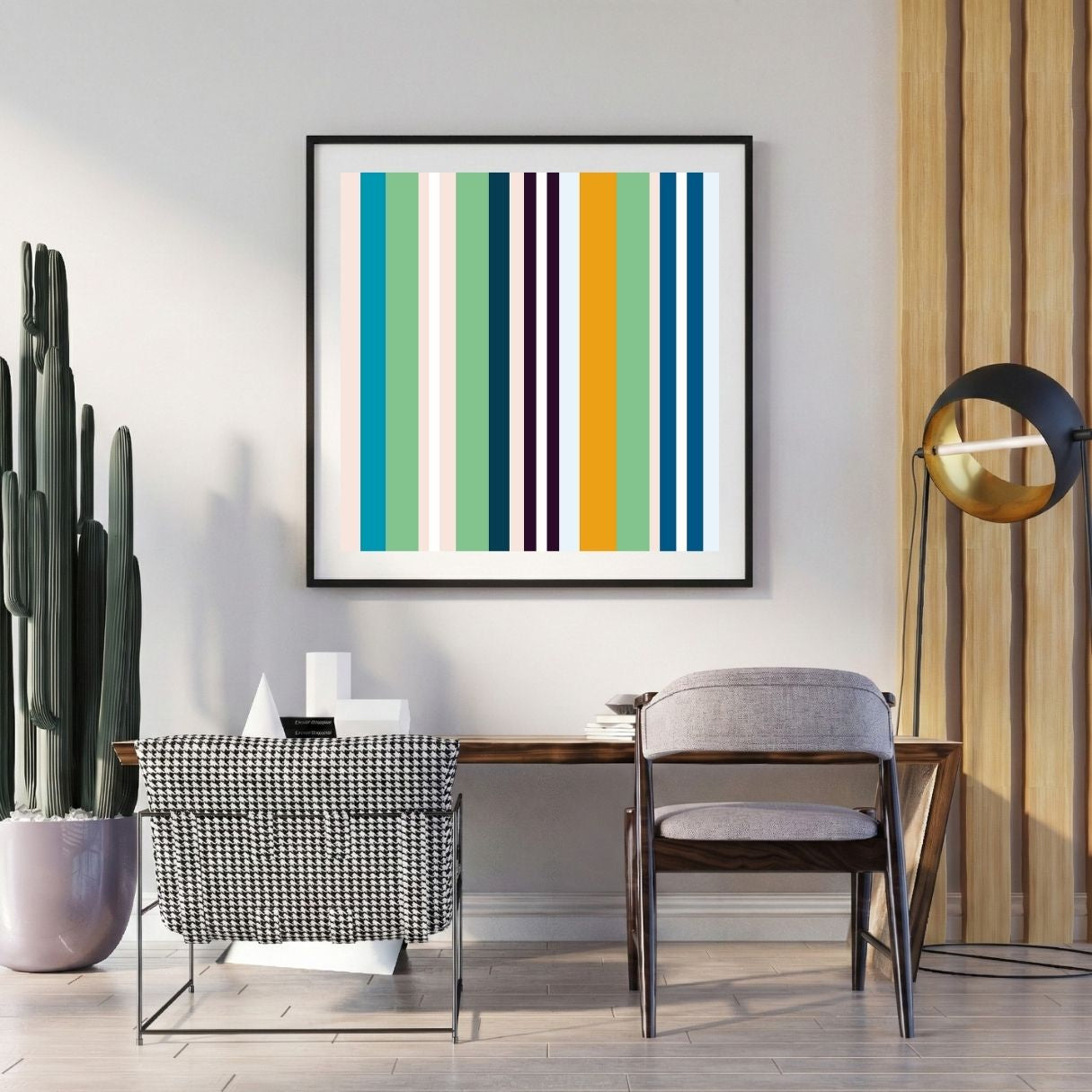 Modern interior with a colorful striped art print on the wall, a desk, and chairs.