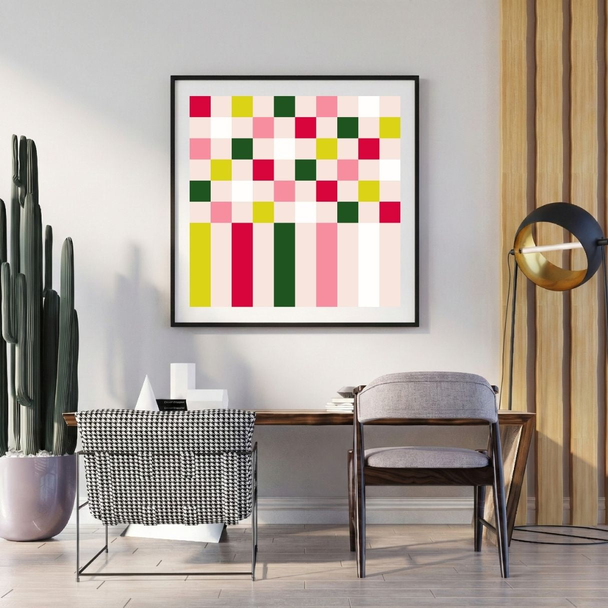 Modern interior with a colorful geometric art piece on the wall, a desk, and chairs.