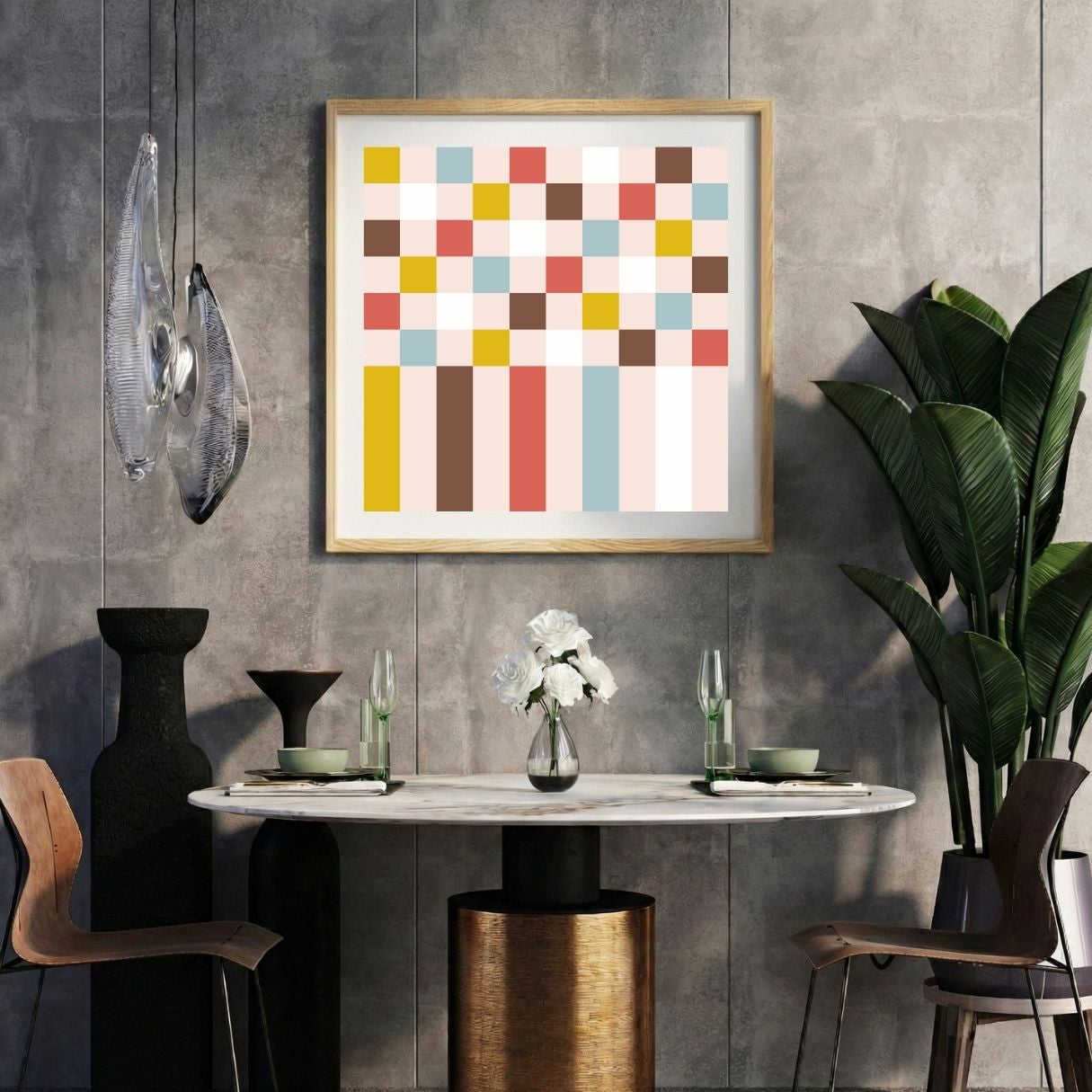 Modern interior with a vintage color geometric pixel print on a gray wall, marble table, and decorative items.