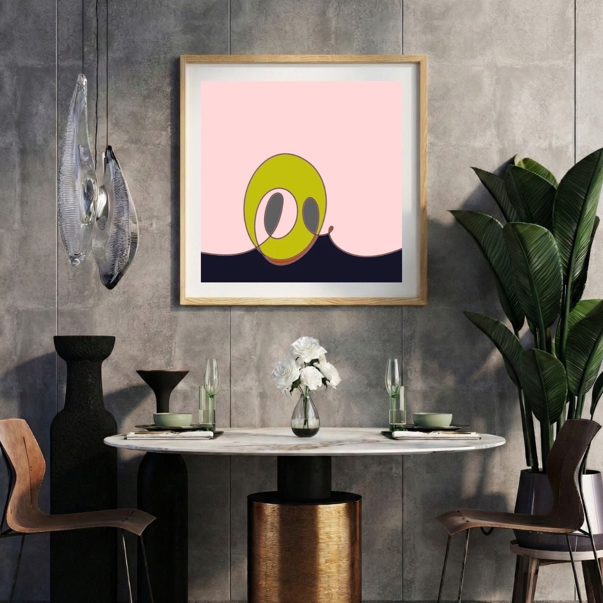 Modern interior with a pink abstract print on a gray wall, marble table, and decorative items.