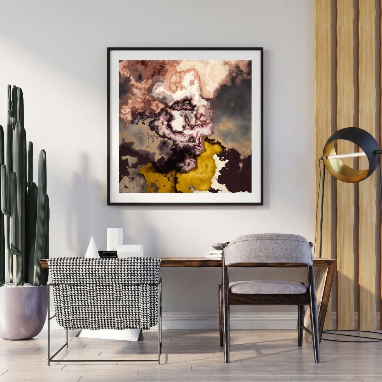 Modern interior with brown abstract art, chairs, and decor items on a light gray wall.