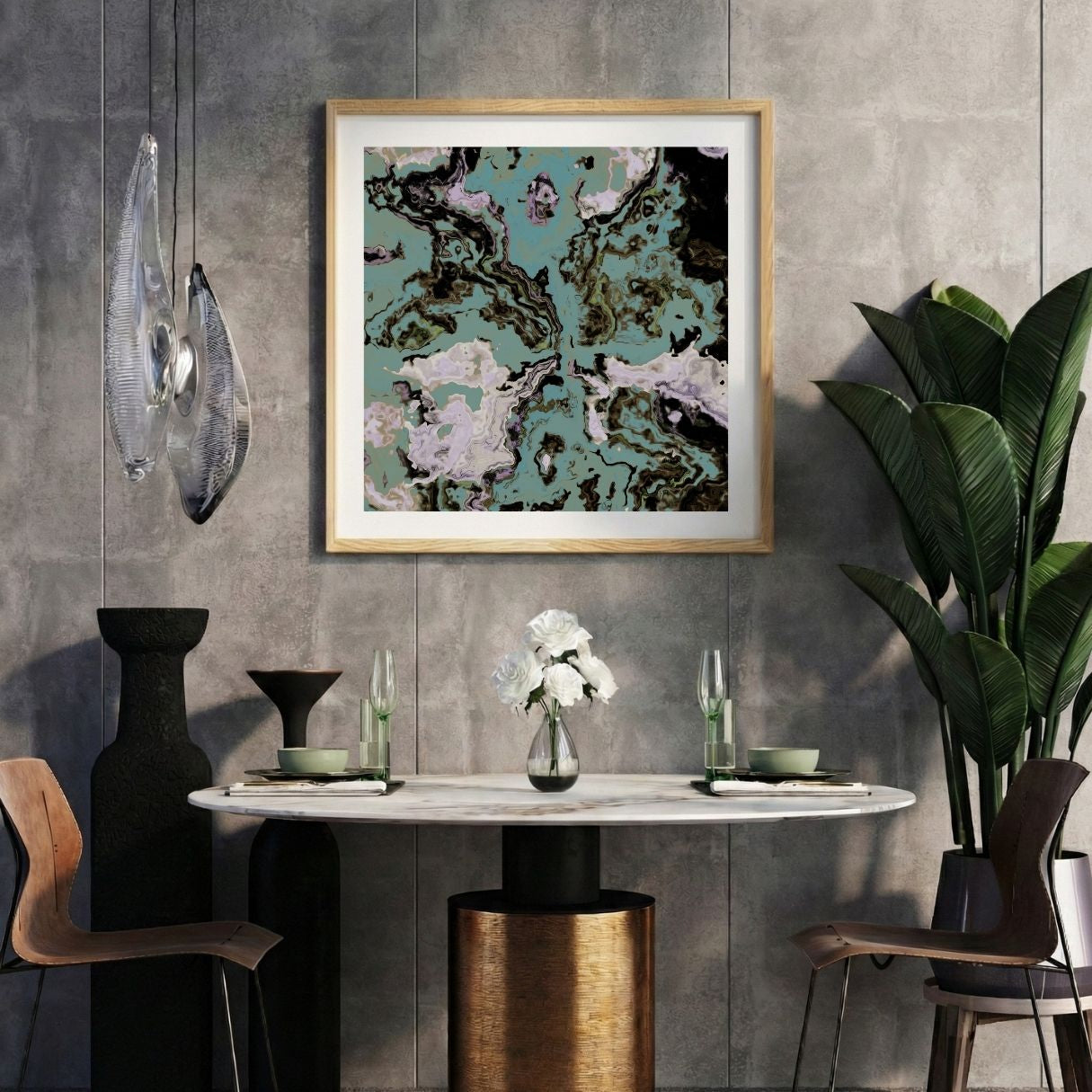 Modern interior with a colorful abstract print on a gray wall, marble table, and decorative items.