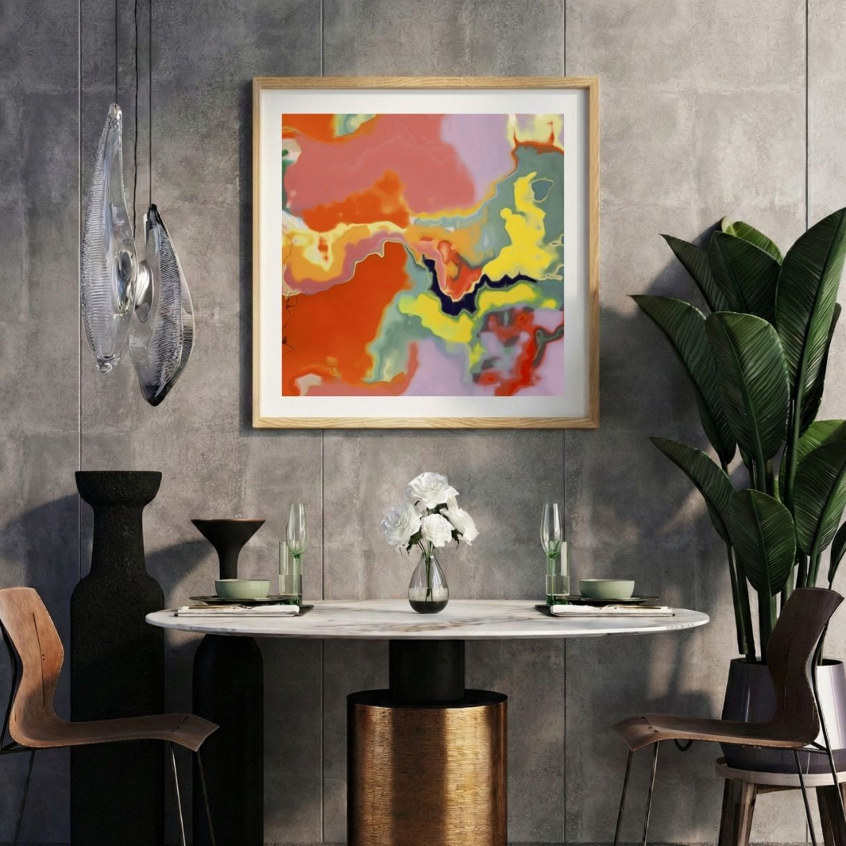Modern interior with a colorful orange abstract print on a gray wall, marble table, and decorative items.