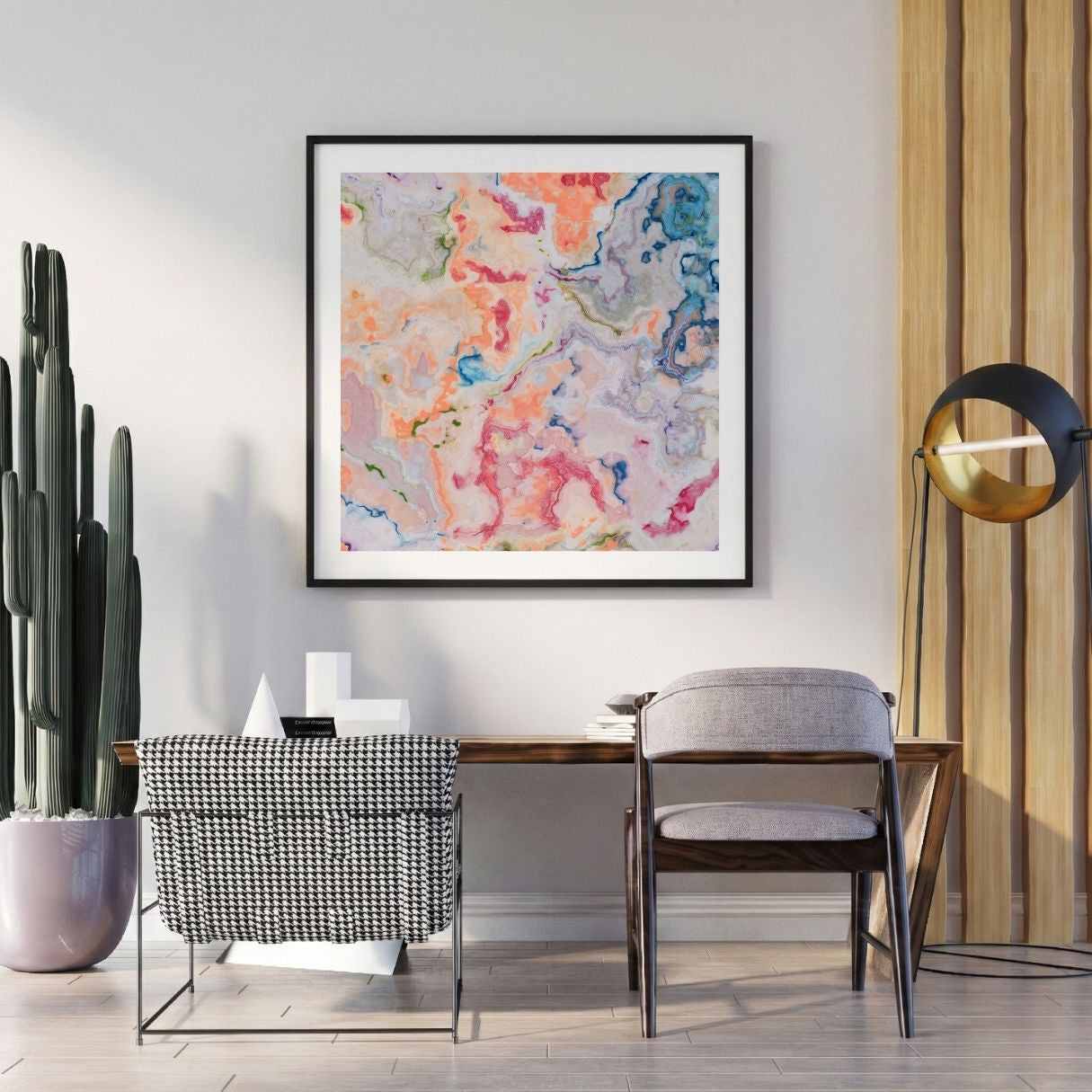Modern interior with a abstract art print on the wall, chair, and potted plant.