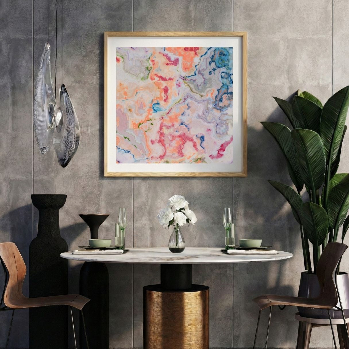 Modern interior with a colorful abstract print on a gray wall, marble table, and decorative items.